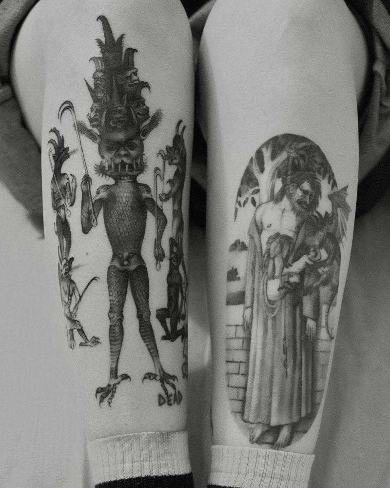 Black and Grey tattoos of a medieval demon and a hanged figure by Matteo Ciampi, The White Whale Tattoo Society, Milano
