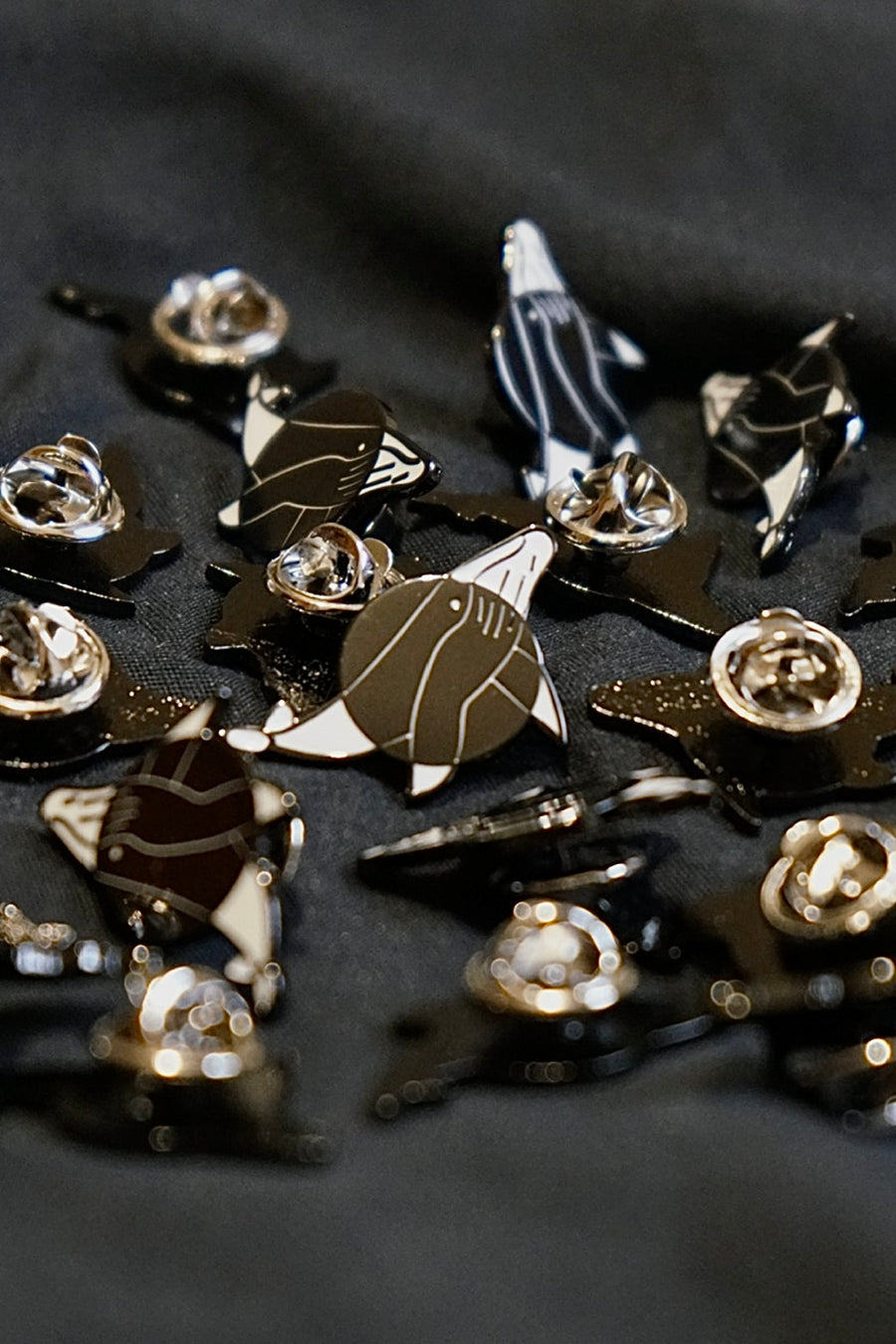 TWWTS Pin, flat enamel pin with the White Whale studio logo