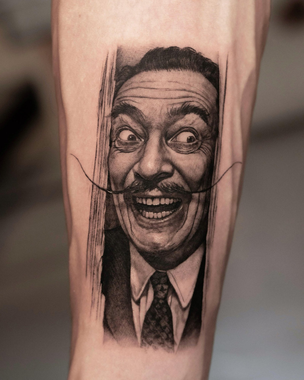 Black and Grey portrait tattoo of Salvador Dalí by Fabio Pillon, The White Whale Tattoo Society, Milano